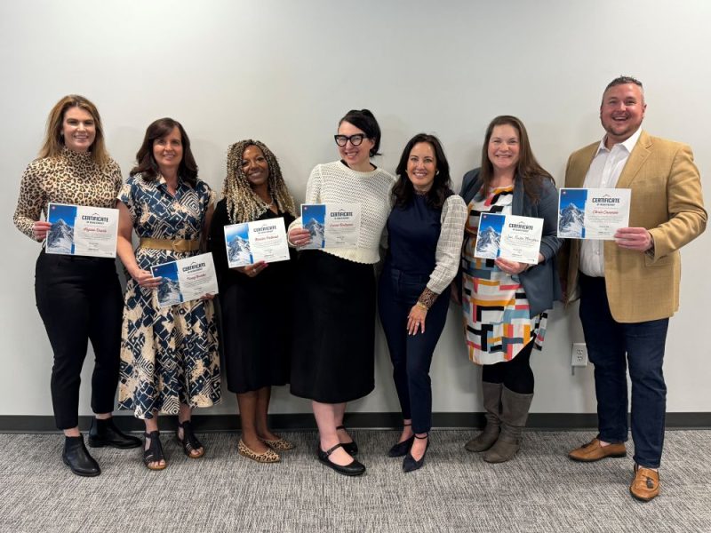 LIFT Participants holding certificates and smiling for completing the program