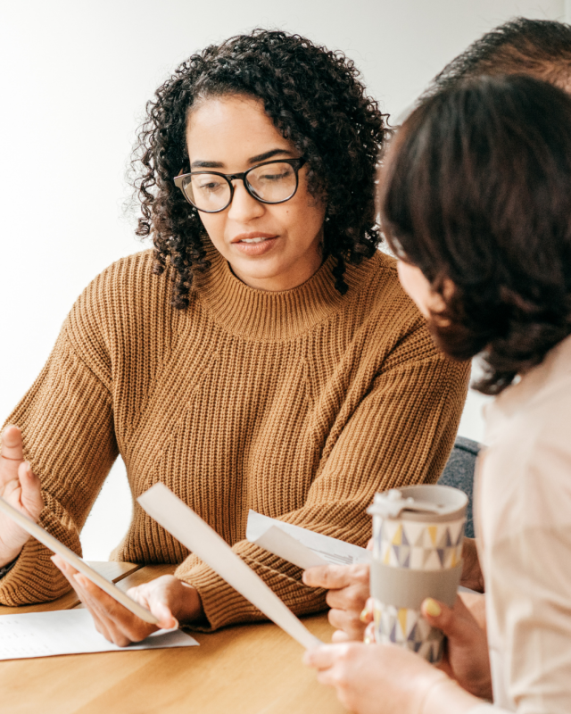 Woman advising others financially.